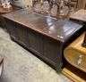An 18th century panelled oak coffer, length 168cm, depth 63cm, height 75cm                                                                                                                                                  