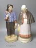 A pair of large Gouda pottery figures of a fisherman and fisherwoman, entitled 'Scheveningen', 41cm                                                                                                                         