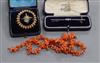 An Edwardian 15ct and diamond bar brooch, a Victorian seed pearl and enamel brooch and a coral necklace.                               