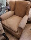 A late Victorian studded upholstered wing armchair                                                                                     