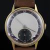 A gentleman's early 1940's 18ct gold Omega manual wind wrist watch,                                                                    