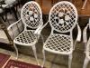 A set of four white painted alumiunum garden elbow chairs, width 57cm depth 55cm height 98cm                                                                                                                                