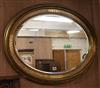 An oval gilt-framed wall mirror W.87cm                                                                                                 