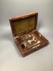 A small leather jewellery box containing assorted silver and other jewellery.                                                                                                                                               