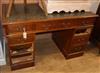 A small Edwardian oak pedestal desk W.122cm                                                                                            