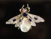 A Victorian gold, sapphire, rose diamond and freshwater pearl 'bee' brooch with ruby eyes                                                                                                                                   