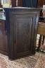 A George III later carved oak hanging corner cabinet, width 72cm, depth 42cm, height 105cm                                                                                                                                  