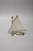 A continental miniature white metal and enamel model of an ice yacht, height 12.5cm, gross 85 grams.                                                                                                                        