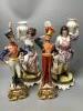 A pair of Italian porcelain figures and a pair of Continental figural candlesticks                                                                                                                                          