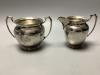 An Edwardian engraved silver four piece tea and coffee service                                                                                                                                                              