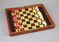 A Jaques & Son Ltd In Statu Quo bone travelling chess set, in mahogany case, c.1860, 9 x 5.5in.                                        