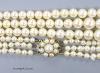 A triple strand graduated cultured pearl choker necklace, with a 9ct and cultured pearl cluster set clasp, 44cm                                                                                                             