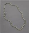 A single strand natural pearl necklace with 18ct white gold and gem set clasp and GCS certificate dated 29/6/18, 40cm.                 