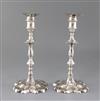 A pair of early George III cast silver candlesticks by Ebenezer Coker, gross 35 oz.                                                    