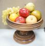 Faux fruit on a turned wood pedestal bowl                                                                                                                                                                                   