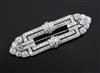 An Art Deco pierced platinum? and diamond set openwork brooch, 59mm.                                                                   