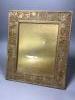 A Tiffany Studio's pierced gilt brass and mottled glass photograph frame, stamped to reverse 'Tiffany Studios, New York 916', overall 36 x 31cm                                                                             