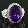 A modern 18k white gold, amethyst and diamond set dress ring, size N.                                                                  