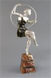 Attributed to G. Limousin. A silvered and bronzed metal figure of a hoop dancer, height 17in.                                          