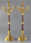 A pair of second quarter of the 19th century French ormolu and rouge marble four light candelabra, height 26.25in.                     