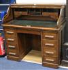 A T. Dobson & Son of Leeds oak tambour top desk W.120cm                                                                                