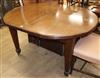 An Edwardian mahogany D-end extending dining table with two leaves length 137cm                                                        