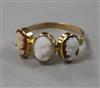 An early 20th century yellow metal and triple cameo ring, size N.                                                                      