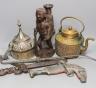 A group of Middle Eastern metalware, a kris, a jambiya, and a figurative carving, 31 cms high.                                                                                                                              