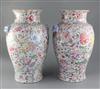 A pair of Chinese 'thousand flower' baluster vases, Republic period, height 40cm excl. wood stands                                     