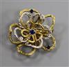 A yellow and white metal open work flower head brooch, set with sapphires and diamonds, 21.6 grams.                                    