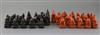 An 18th century red and black lacquer Burmese figural chess set, kings 3in.                                                            