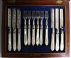 A cased set of twelve pairs of mother of pearl handled silver dessert eaters, James Collins, Birmingham, 1857.                         