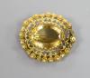 A late Victorian yellow metal and citrine set oval brooch, with canetile work decoration                                                                                                                                    