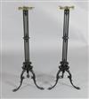 A pair of Regency cast iron candlesticks, height 33.5in.                                                                               