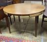 A mid century design Frem Rojle Roundette extending circular teak dining table, diameter 120cm, height 74cm                                                                                                                 