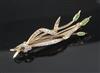 A yellow metal, diamond and gem set "bullrushes" brooch, 52mm.                                                                         