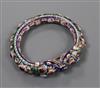 An Indian enamelled and foil backed paste? set white metal bangle.                                                                     