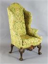 An early 18th century style mahogany wing armchair, W.2ft 8in. D.2ft 8in. H.4ft 9in.                                                   