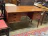 A mid century Danish teak kneehole dressing table of rectangular concave form, width 116cm, depth 55cm, height 72cm                                                                                                         