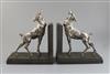 E. Carlier. A pair of silvered and bronzed metal bookends modelled as fawns, 8.25in.                                                   