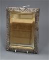 A Persian repousse white metal mounted rectangular hanging mirror, 20.7cm.                                                             