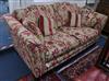 An upholstered deep seated two seater settee W.200cm                                                                                   