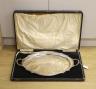 A cased George V silver two handled tea tray, with engraved inscription and crest, Synyer & Beddoes, Birmingham, 1928, 61.2cm, 79oz.                                                                                        