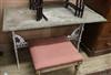 A Victorian cast iron table with a stone top W.112cm                                                                                   