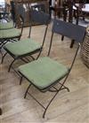 Four wrought iron folding chairs                                                                                                       