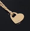 A modern 18ct gold Cartier pierced heart shaped pendant, on an 18ct gold Cartier fine link chain, chain 40cm.                          