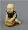 A Japanese ivory inlaid figurative netsuke                                                                                             