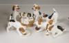 Seven Royal Doulton models of terrier puppies                                                                                                                                                                               