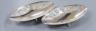 A pair of Indian sterling oval dishes, embossed with figures and elephants, 24.9cm, 18.5oz.                                                                                                                                 