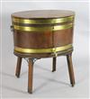 A George III brass banded mahogany oval wine cooler, W.2ft 1in. D.1ft 6in. H.2ft 4in.                                                  